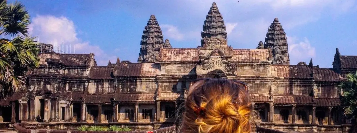 back of person looking at Angkor Wat temple