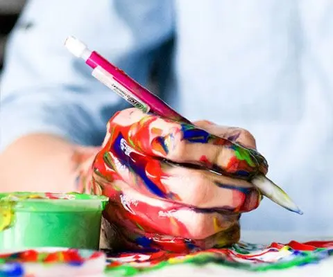 hands covered in paint