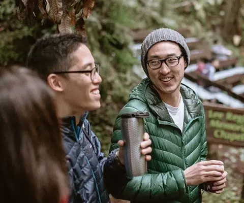 Three adult volunteers working outside