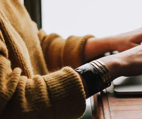 woman typing on keyboard