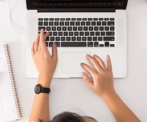 laptop and open planner