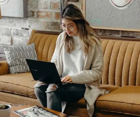 person working from their couch