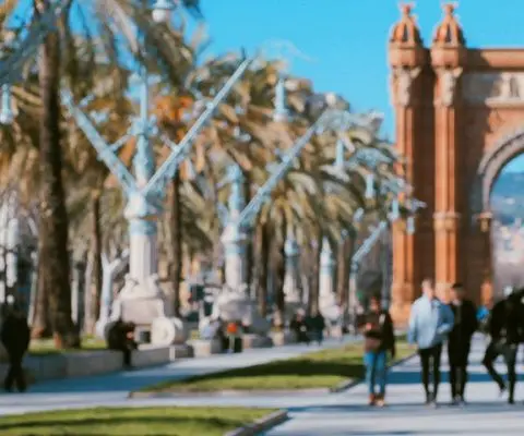 person standing at arco de triunfo in barcelona