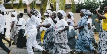 crowd of people walking down street