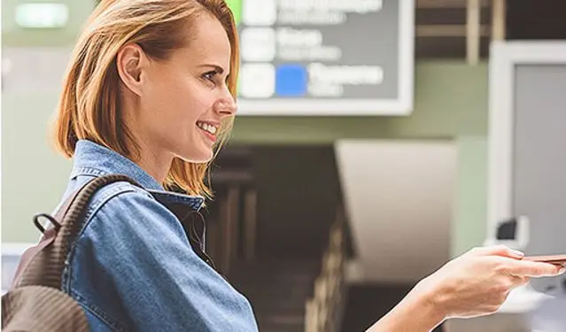 girl handing over her passport