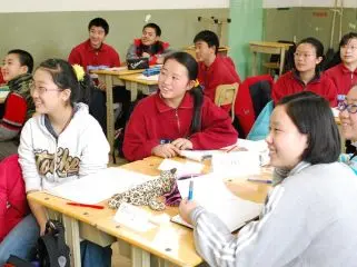 Students attentively listening to their lecturer.